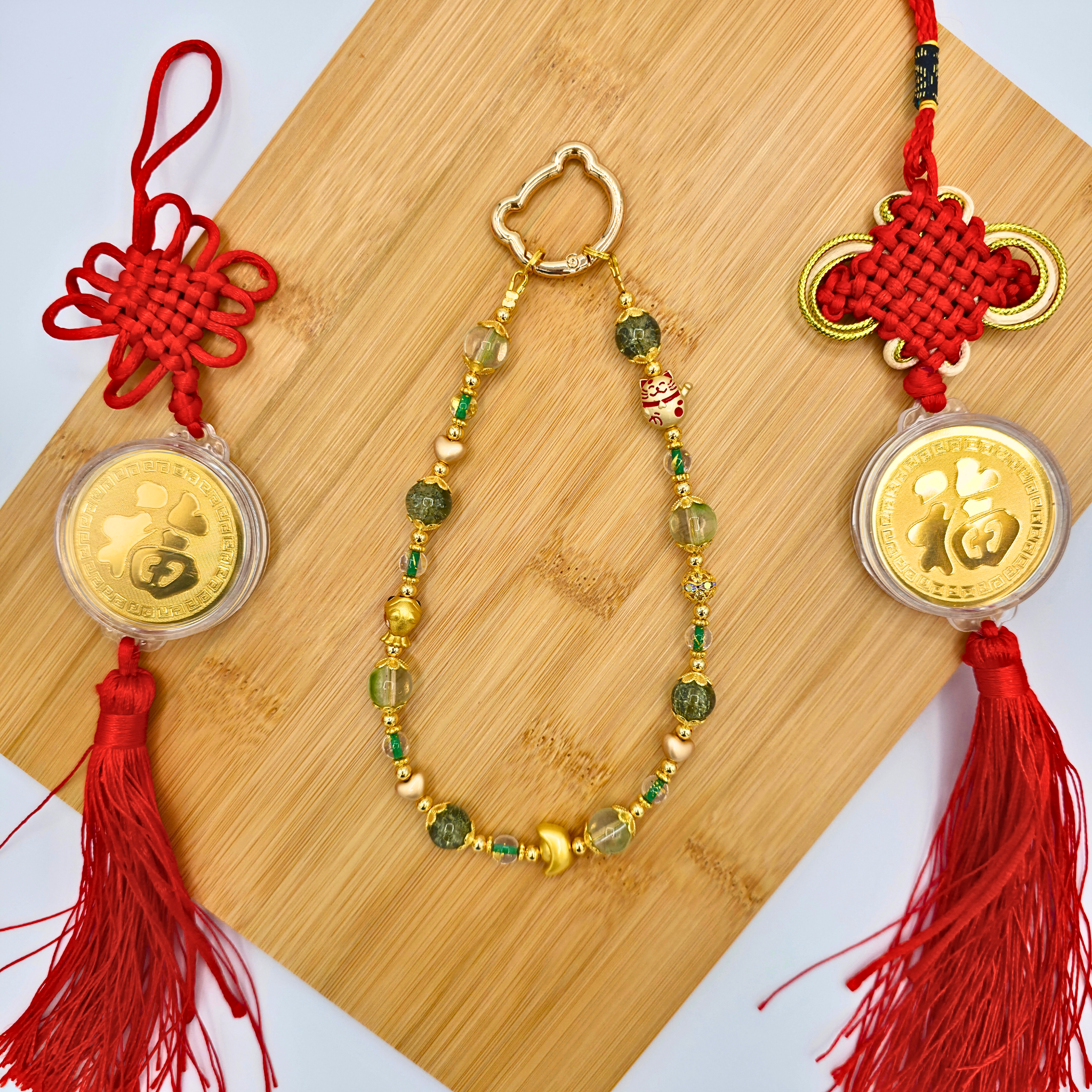 Green lunar new year phone charm made with glass and metal beads - product is shown with Lucky Knotted Talismans.